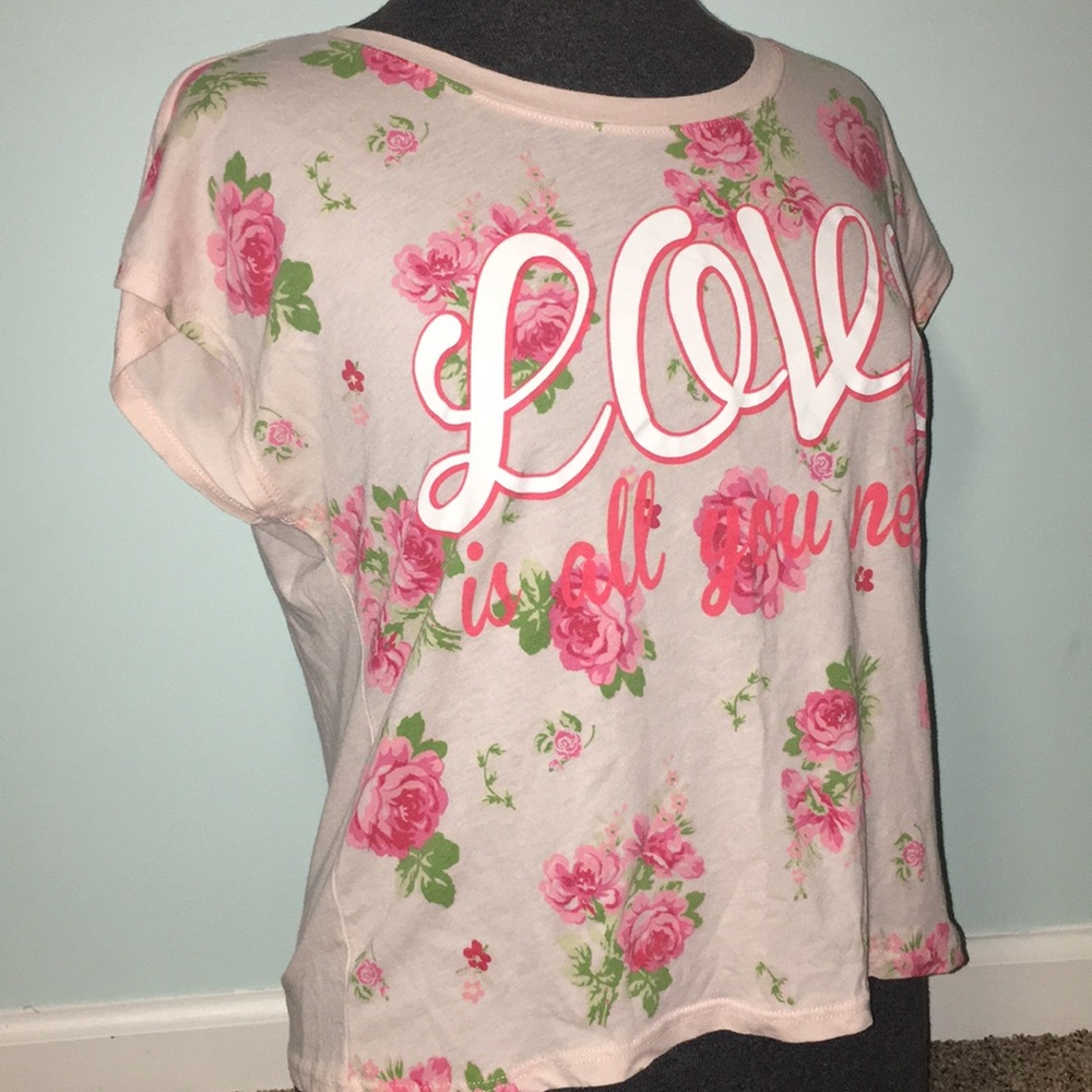 pink shirt with flowers on front